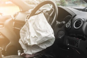 An airbag deployed after a car accident.