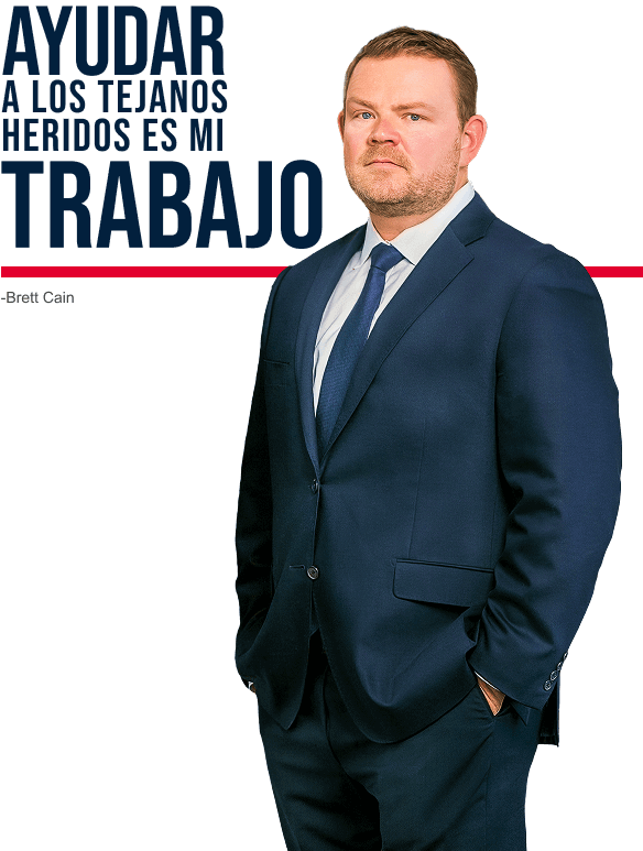 Brett Cain in navy suit standing confidently beside Spanish text that reads ‘Ayudar a los Tejanos heridos es mi trabajo